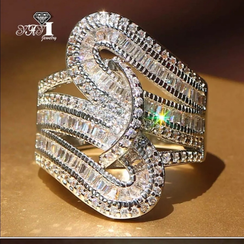 (1) Trendy Twisted simulated Diamond Ring Sz 7 and size 8.